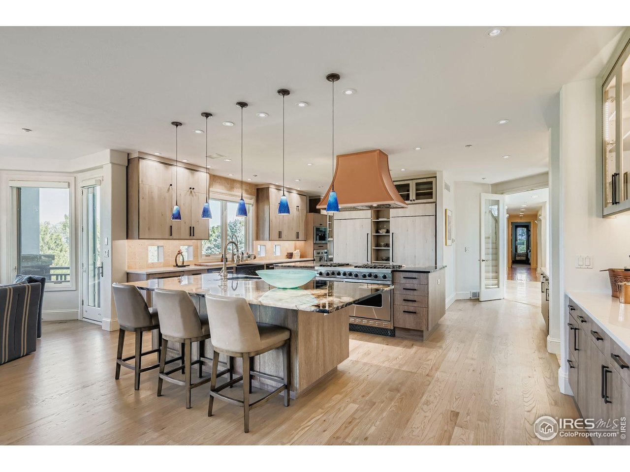 8001 Fairview Road Boulder, CO 80303 - Photo 11 of 49 a open dining room with stainless steel appliances kitchen island granite countertop a table chairs and a refrigerator