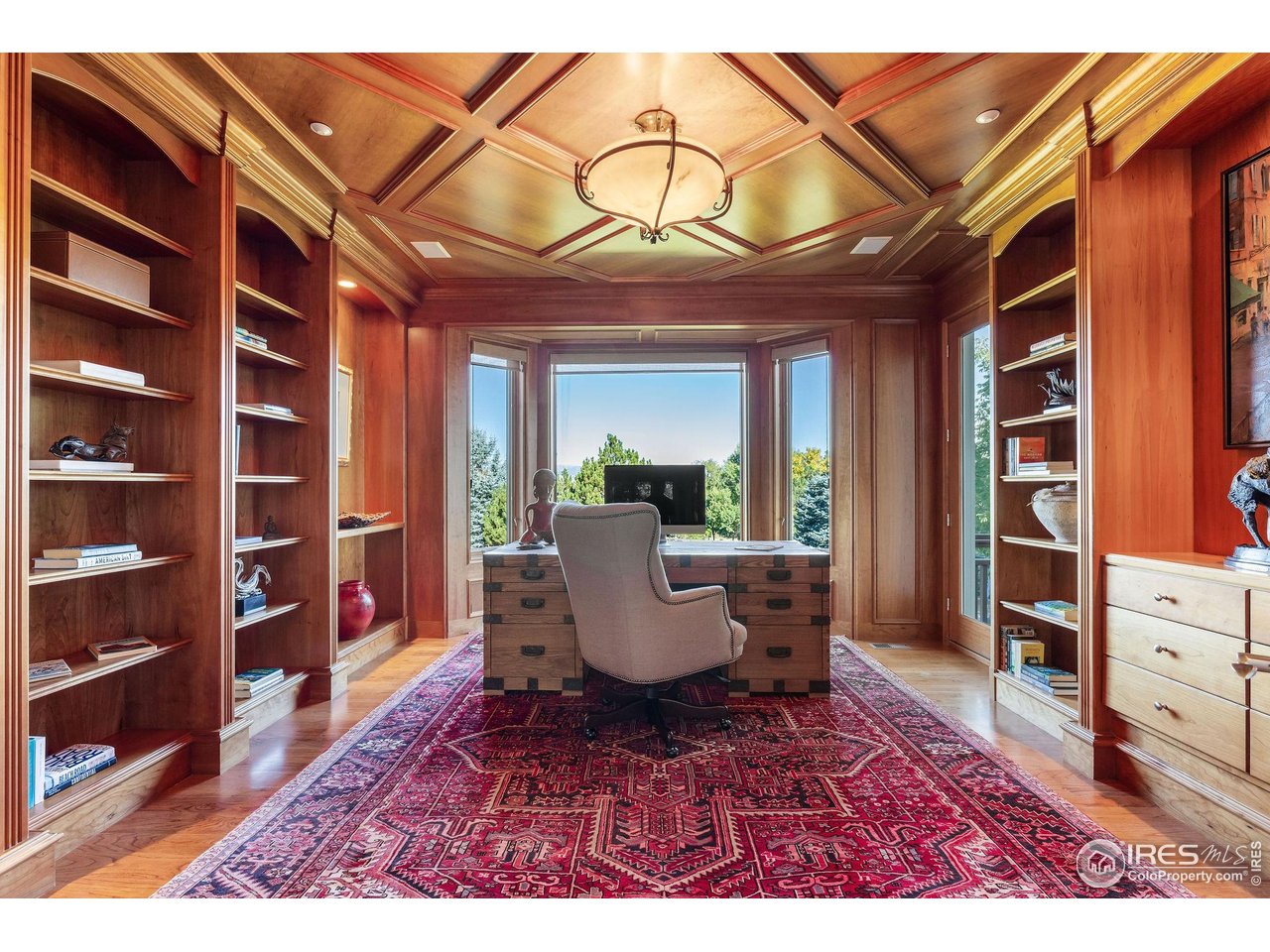 8001 Fairview Road Boulder, CO 80303 - Photo 16 of 49 a living room with furniture and a book shelf
