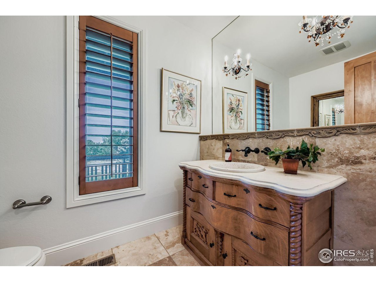 8001 Fairview Road Boulder, CO 80303 - Photo 17 of 49 a bathroom with a sink mirror and a window