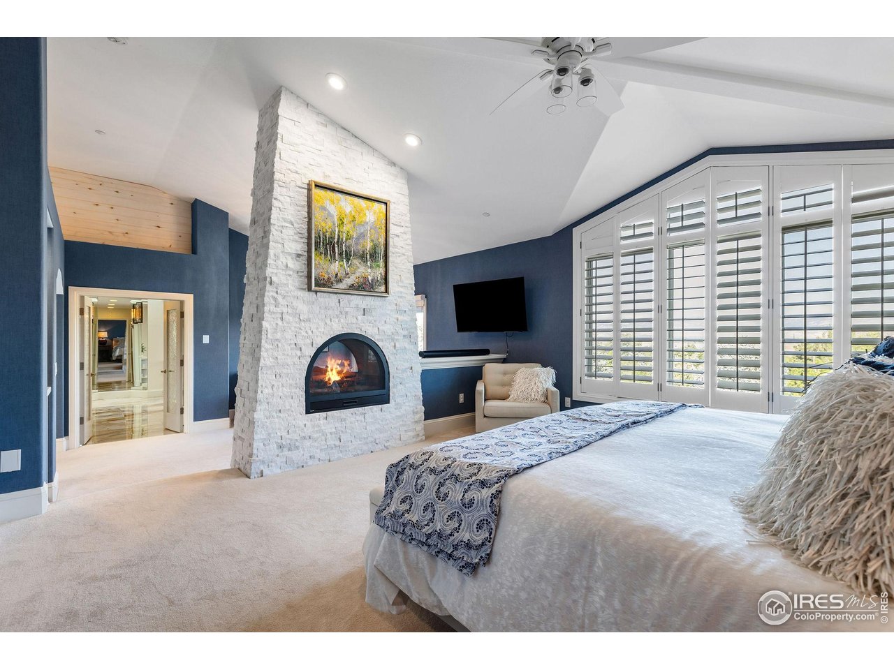 8001 Fairview Road Boulder, CO 80303 - Photo 19 of 49 a bedroom with a bed and a fireplace