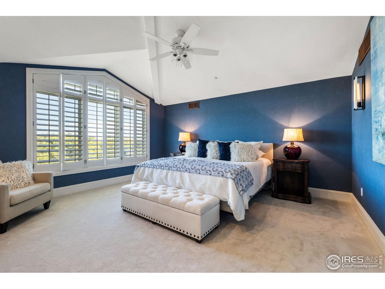 8001 Fairview Road Boulder, CO 80303 - Photo 20 of 49 a bedroom with a bed lamp and a large window