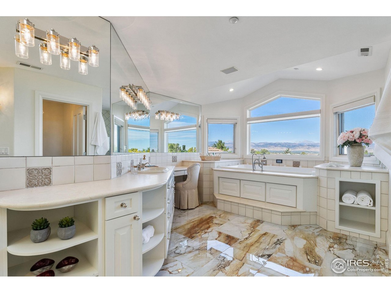 8001 Fairview Road Boulder, CO 80303 - Photo 24 of 49 a large white kitchen with a stove a sink dishwasher and cabinets with wooden floor