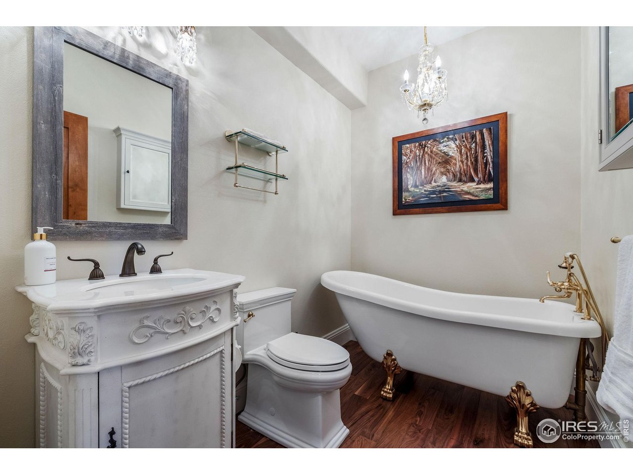 8001 Fairview Road Boulder, CO 80303 - Photo 33 of 49 a bathroom with a toilet a sink and mirror