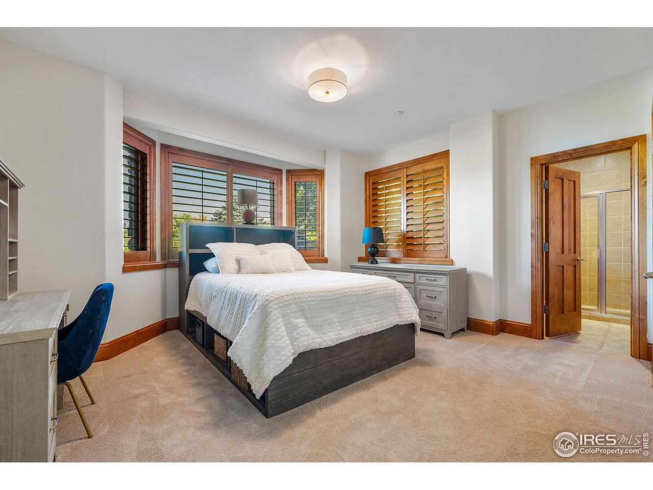 8001 Fairview Road Boulder, CO 80303 - Photo 34 of 49 a spacious bedroom with a bed and a window