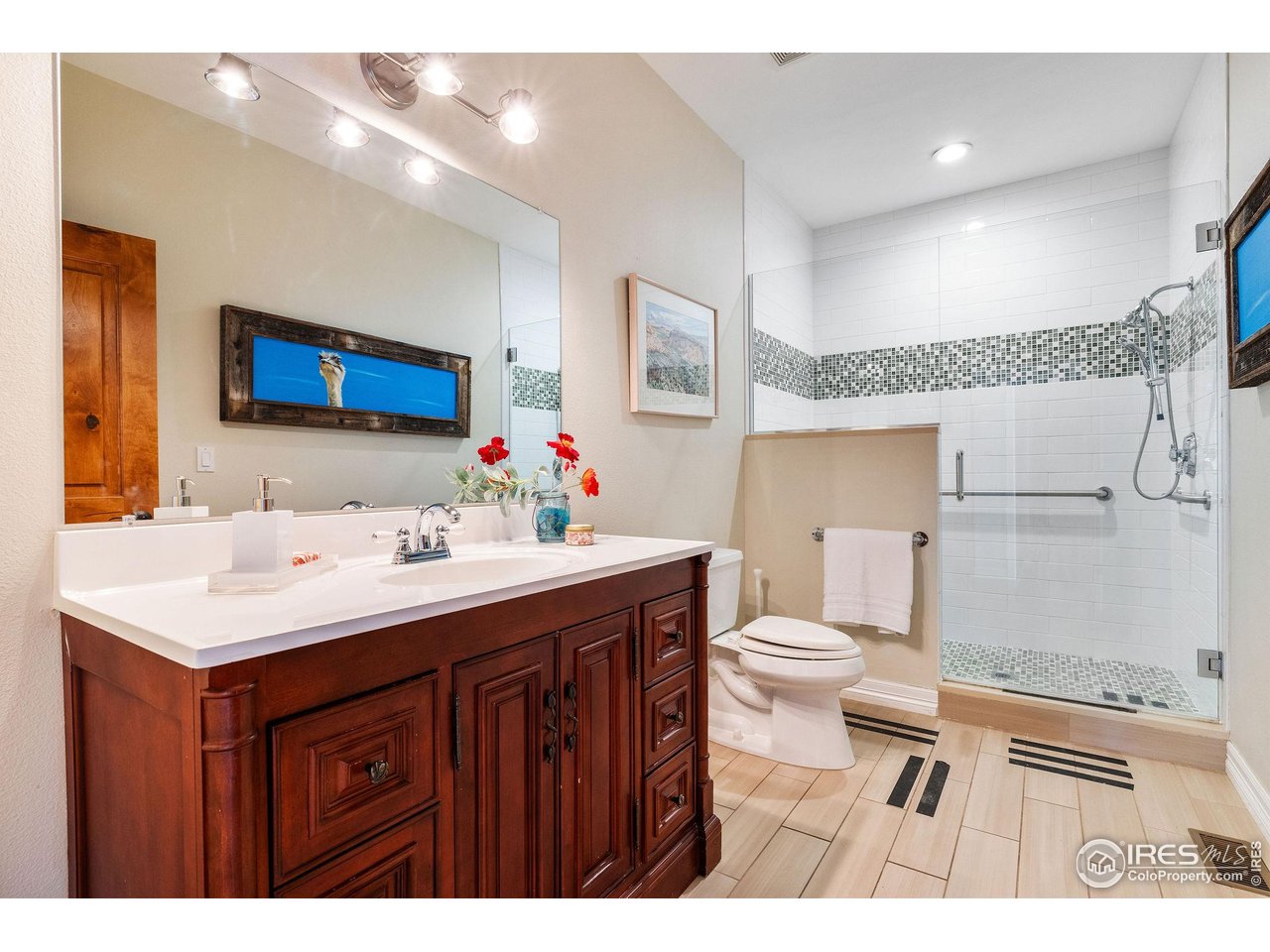 8001 Fairview Road Boulder, CO 80303 - Photo 40 of 49 a bathroom with a sink a toilet and a mirror