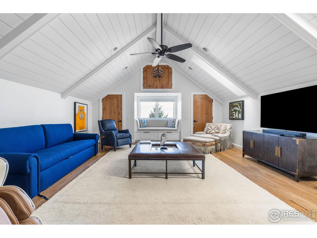 8001 Fairview Road Boulder, CO 80303 - Photo 42 of 49 a living room with furniture a large window and flat screen tv