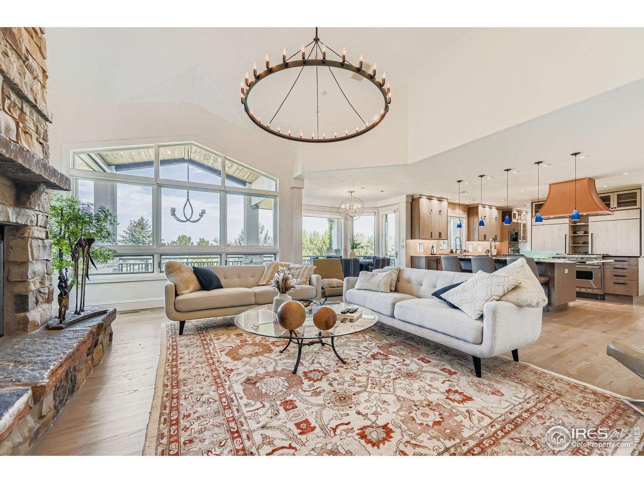 8001 Fairview Road Boulder, CO 80303 - Photo 8 of 49 a living room with furniture a fireplace a rug and a large window