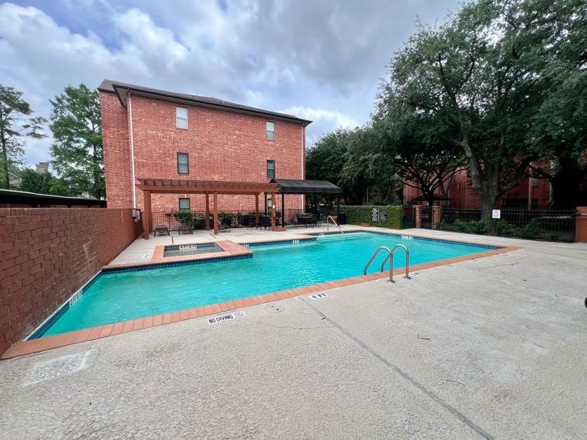 4041 Drake Street, Unit 118 Houston, TX 77005 - Photo 2 of 22 a view of a house with a yard and sitting area