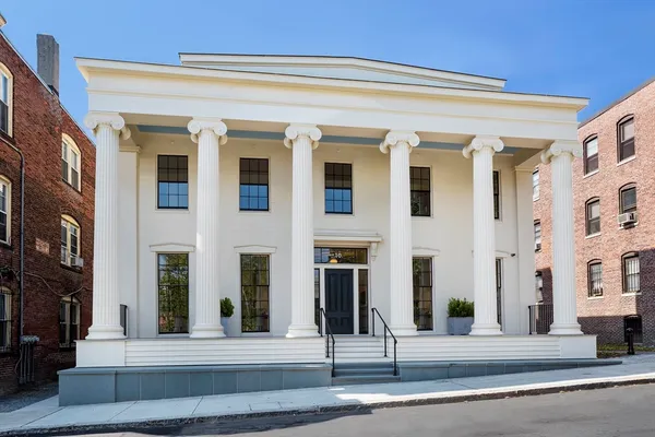 a front view of a building with street view