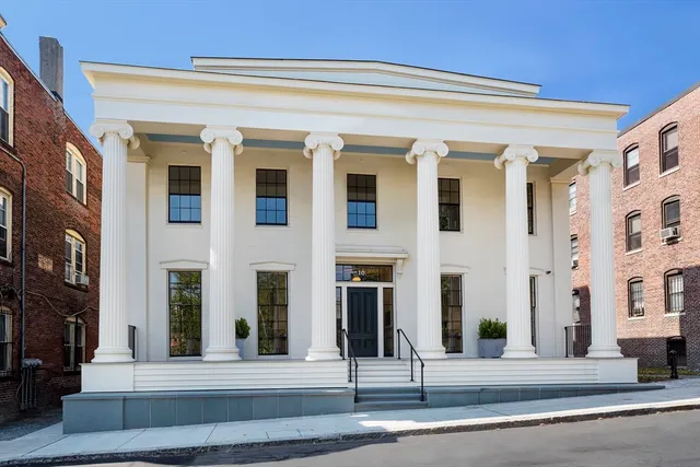 a front view of a building with street view