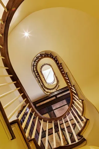 a living room with furniture and floor to ceiling windows