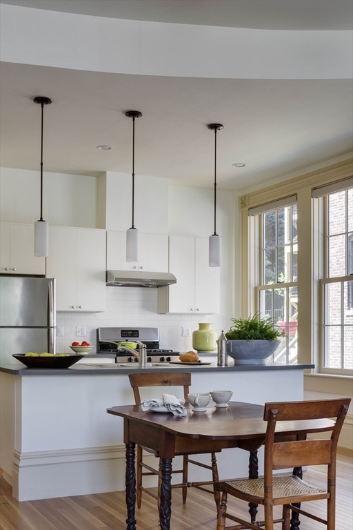 10 Linwood Street Boston, MA 02119 - Photo 15 of 33 a kitchen with stainless steel appliances granite countertop a stove a sink and a refrigerator