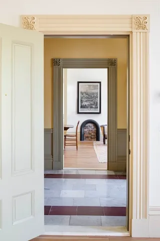a kitchen with stainless steel appliances granite countertop a sink and a wooden floor