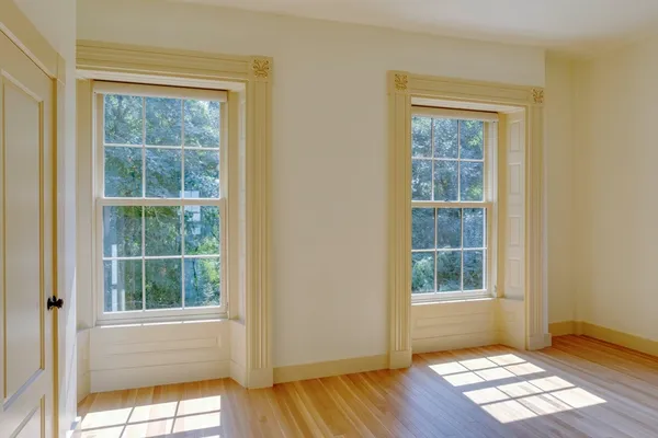 a bedroom with furniture and windows