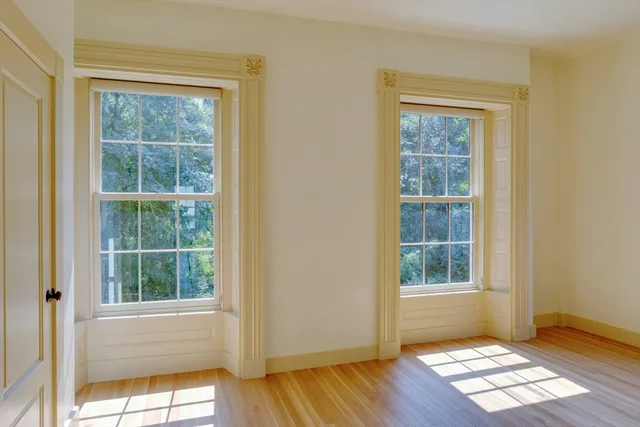 a bedroom with furniture and windows