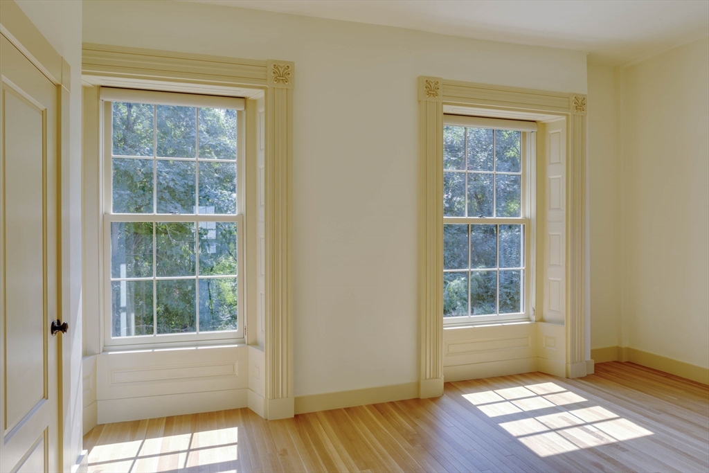 10 Linwood Street Boston, MA 02119 - Photo 20 of 33 an empty room with wooden floor and windows