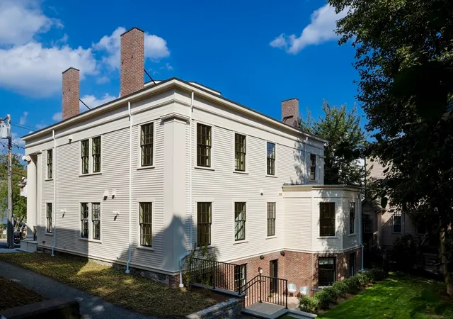a view of a patio with a table and chairs and wooden floor