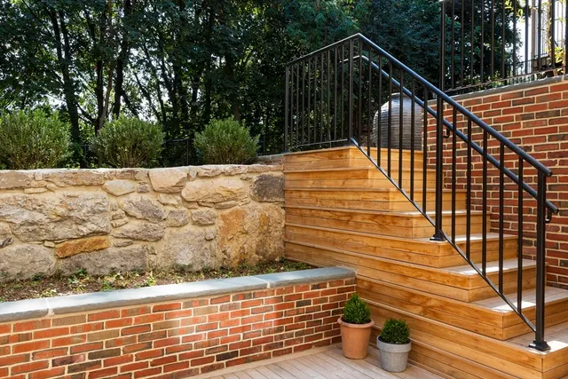 a bathroom with double vanity sink and a mirror