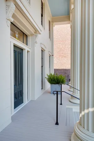 a view of front door with a mirror