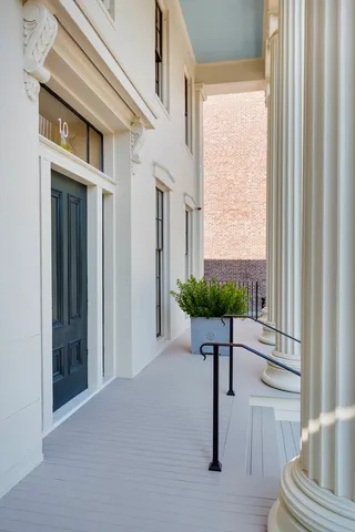 a view of front door with a mirror