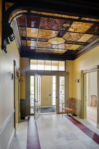 a view of entryway with wooden floor