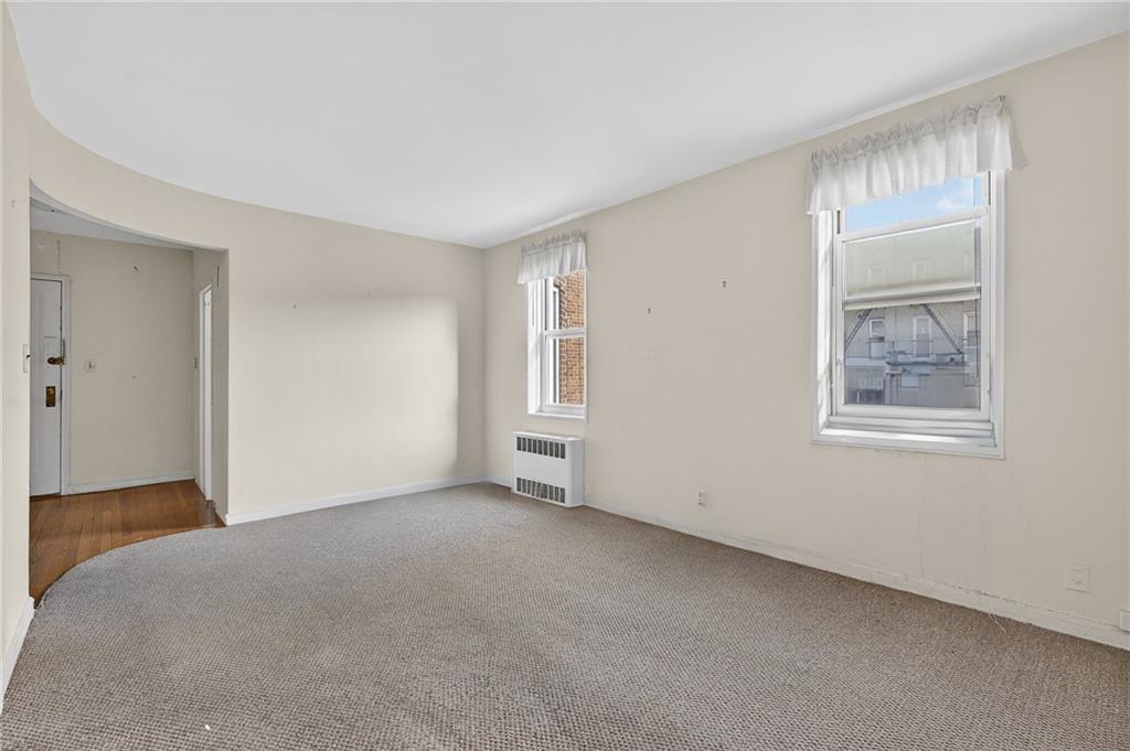 6801 Shore Road, Unit 2N Brooklyn, NY 11220 - Photo 4 of 16 a view of an empty room with a window