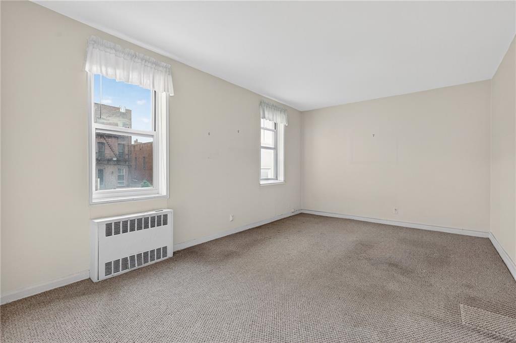6801 Shore Road, Unit 2N Brooklyn, NY 11220 - Photo 5 of 16 a view of an empty room with a window