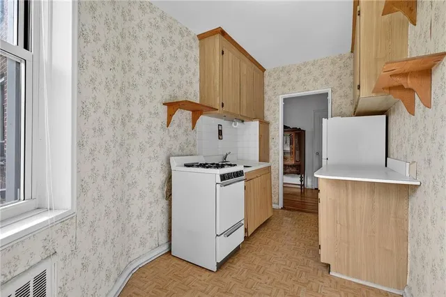 a kitchen with a stove and a sink