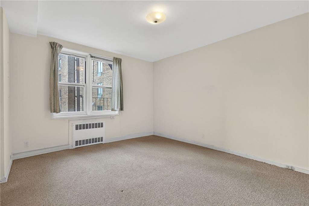 6801 Shore Road, Unit 2N Brooklyn, NY 11220 - Photo 8 of 16 an empty room with a window