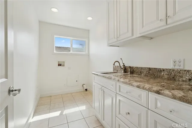a kitchen with white cabinets