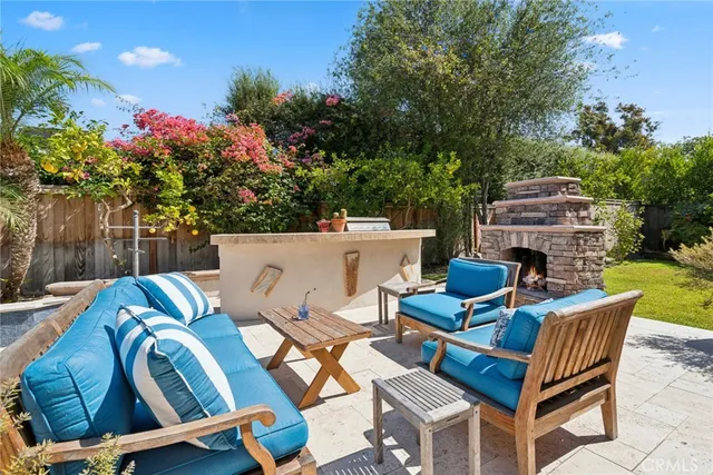 a backyard of a house with table and chairs