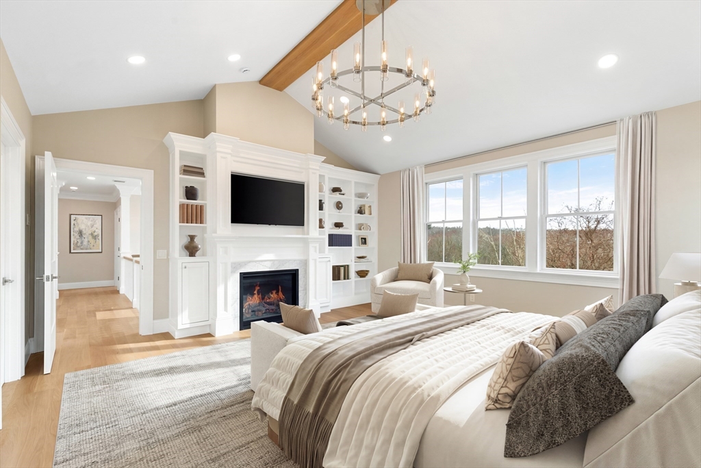320 Concord Avenue Lexington, MA 02421 - Photo 20 of 40 a spacious bedroom with a large bed and a fireplace