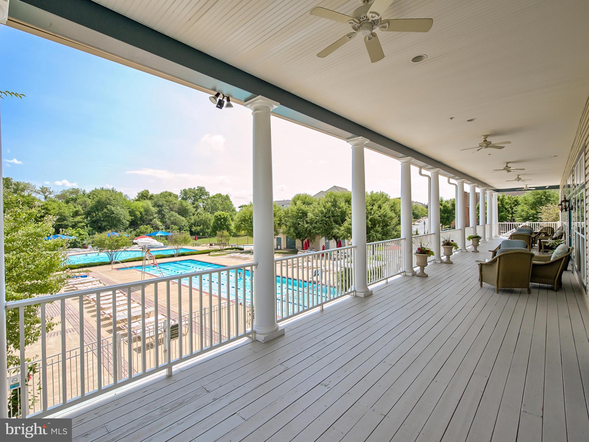 2447 Bear Den Road Frederick, MD 21701 - Photo 23 of 26 a view of a porch with wooden floor and outdoor seating