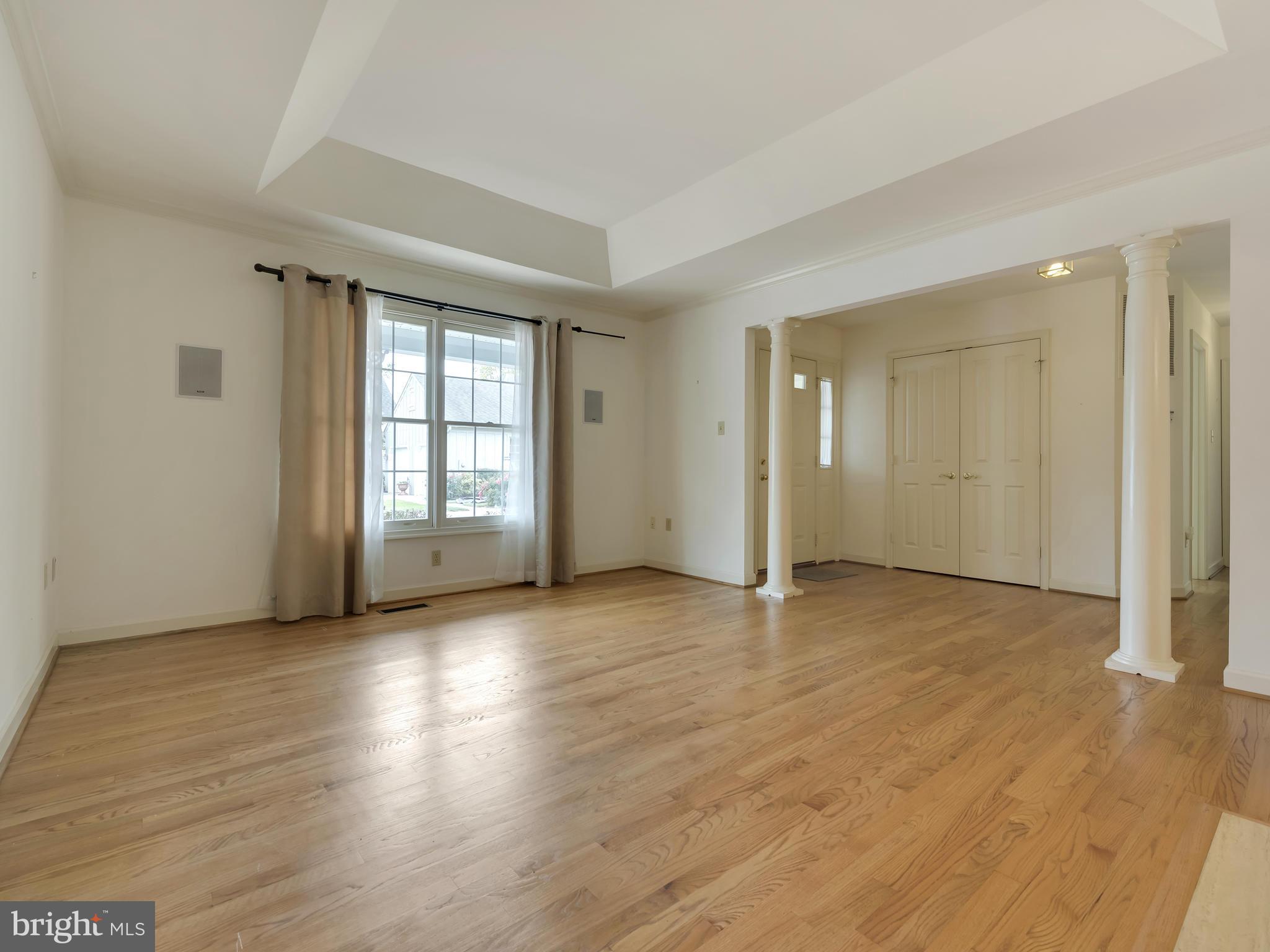 2447 Bear Den Road Frederick, MD 21701 - Photo 4 of 26 an empty room with wooden floor and windows