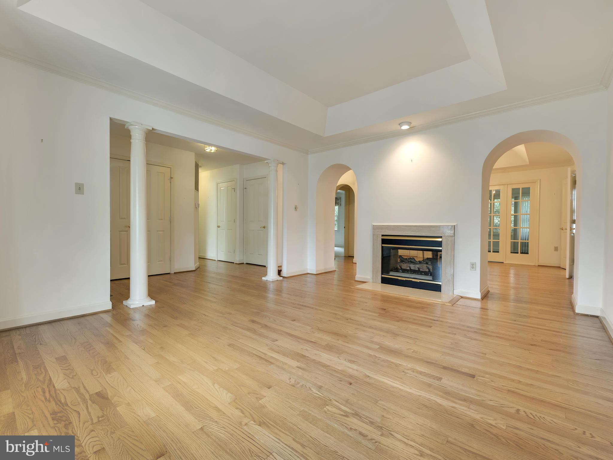 2447 Bear Den Road Frederick, MD 21701 - Photo 5 of 26 a view of a livingroom with wooden floor and a fireplace