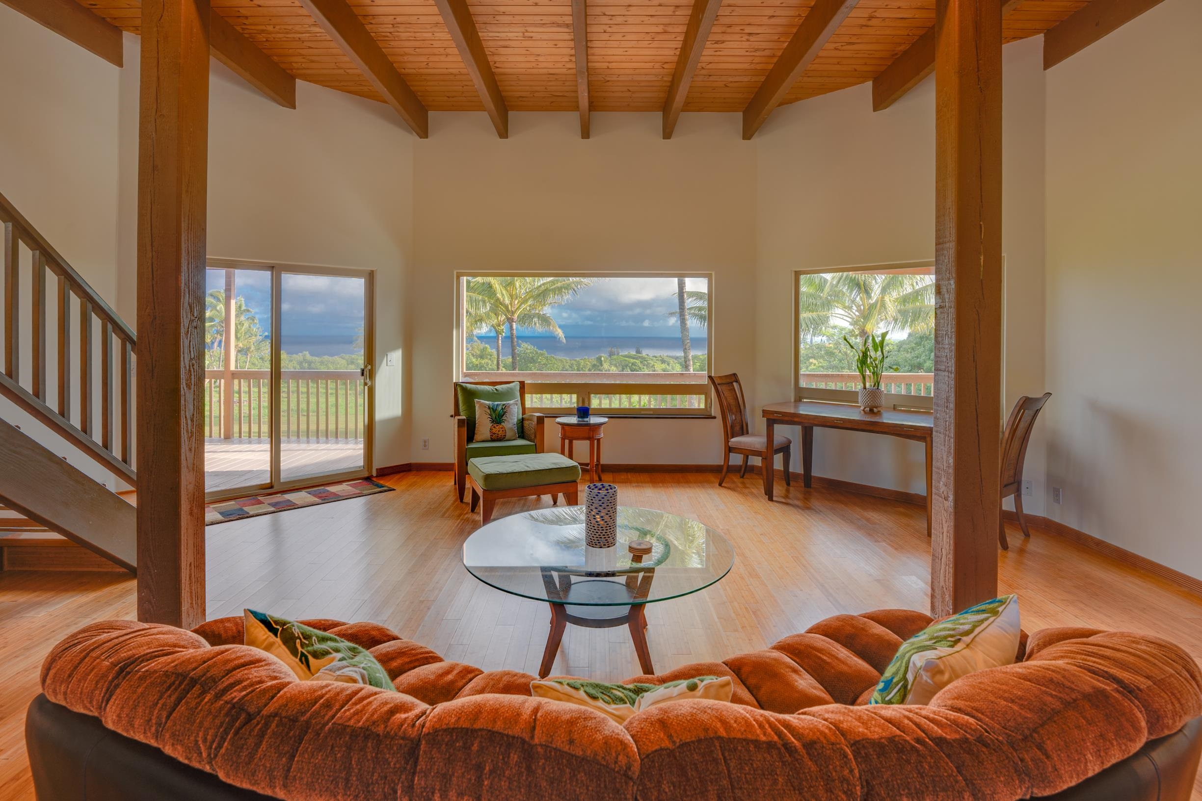 480 Puniawa Road Haiku, HI 96708 - Photo 11 of 30 a living room with furniture a rug and a large window