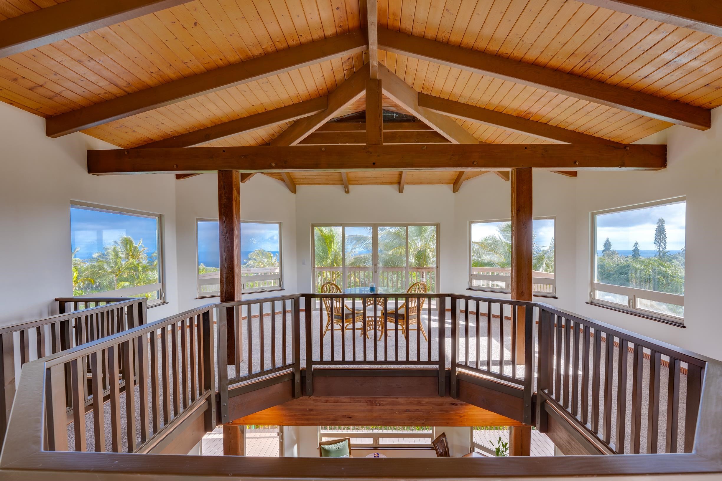 480 Puniawa Road Haiku, HI 96708 - Photo 24 of 30 a view of a porch with wooden floor