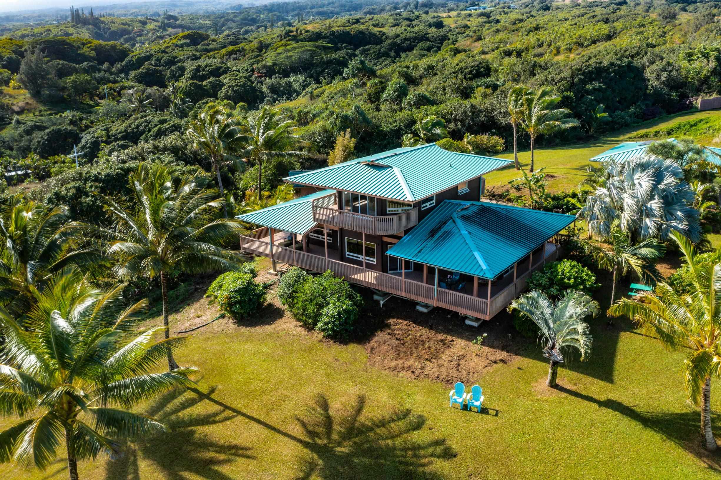 480 Puniawa Road Haiku, HI 96708 - Photo 5 of 30 an aerial view of a house with swimming pool and large trees