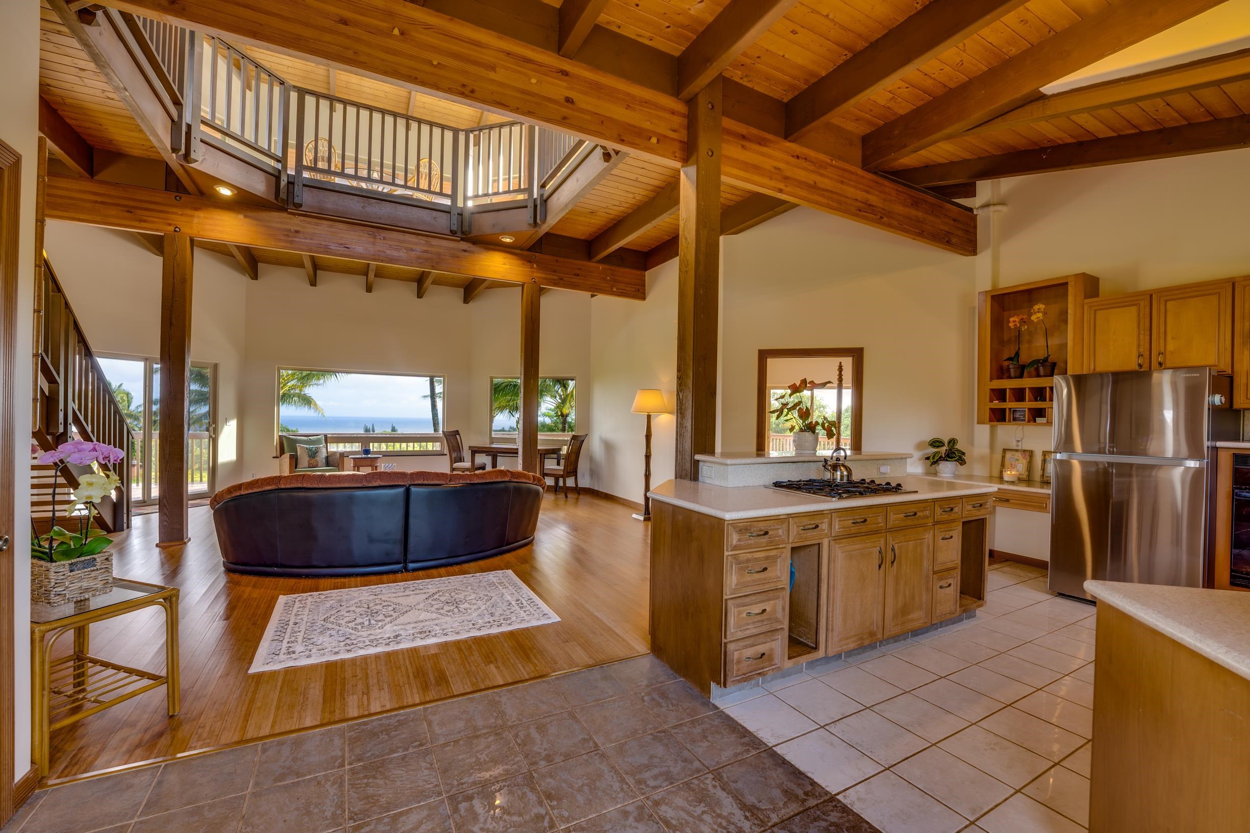 480 Puniawa Road Haiku, HI 96708 - Photo 8 of 30 a kitchen with stainless steel appliances granite countertop a stove a sink and a refrigerator