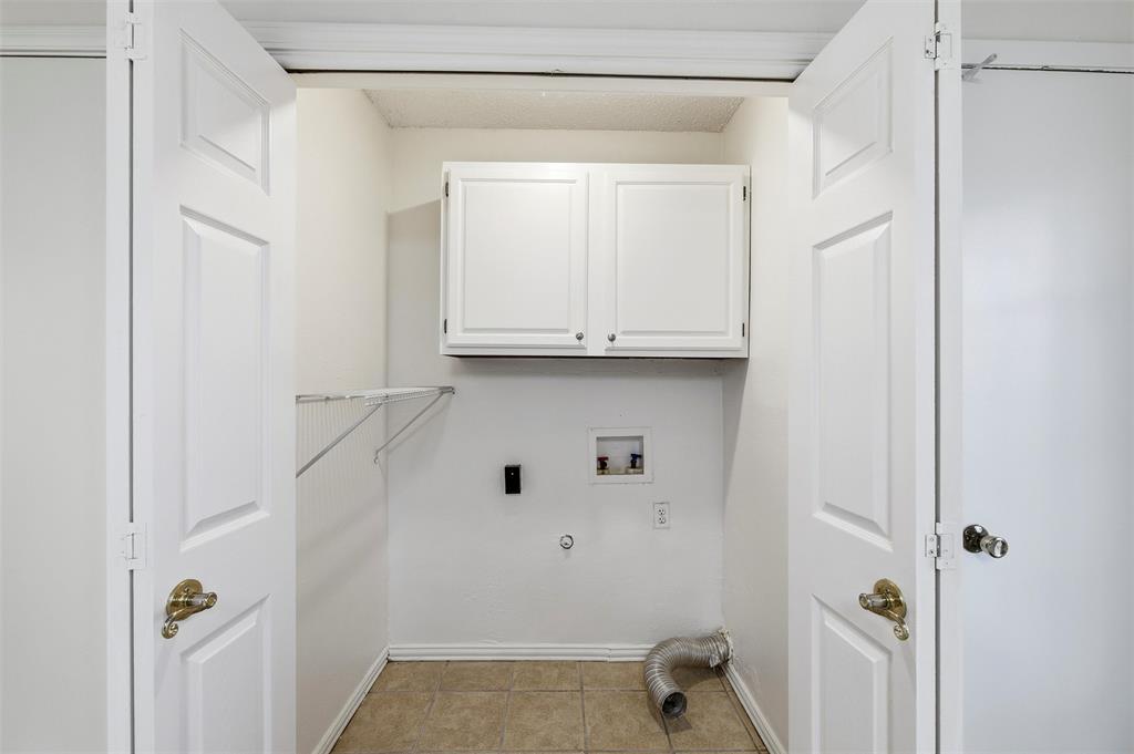 800 Howell Drive Coppell, TX 75019 - Photo 14 of 24 a bathroom with a sink and a mirror