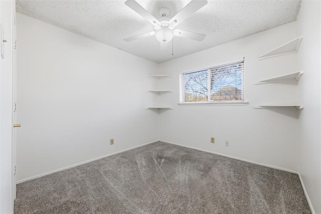 800 Howell Drive Coppell, TX 75019 - Photo 20 of 24 an empty room with a fan & a window