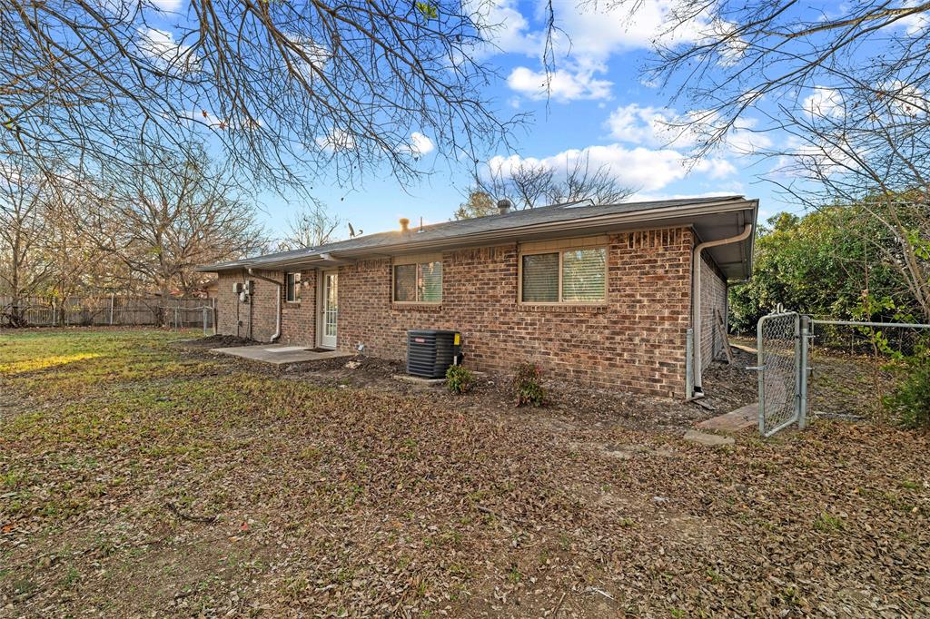 800 Howell Drive Coppell, TX 75019 - Photo 24 of 24 a view of a house with a yard