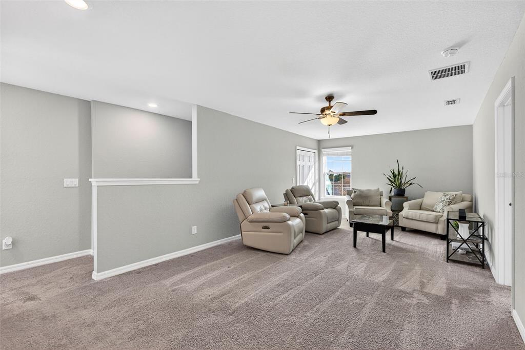 82 Berlin Avenue St. Cloud, FL 34771 - Photo 25 of 44 a living room with furniture