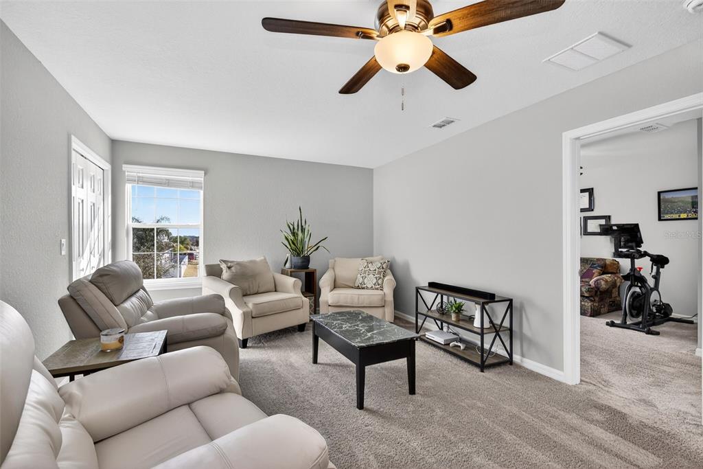 82 Berlin Avenue St. Cloud, FL 34771 - Photo 26 of 44 a living room with furniture