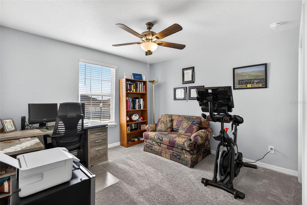 82 Berlin Avenue St. Cloud, FL 34771 - Photo 27 of 44 a work room with furniture and a window
