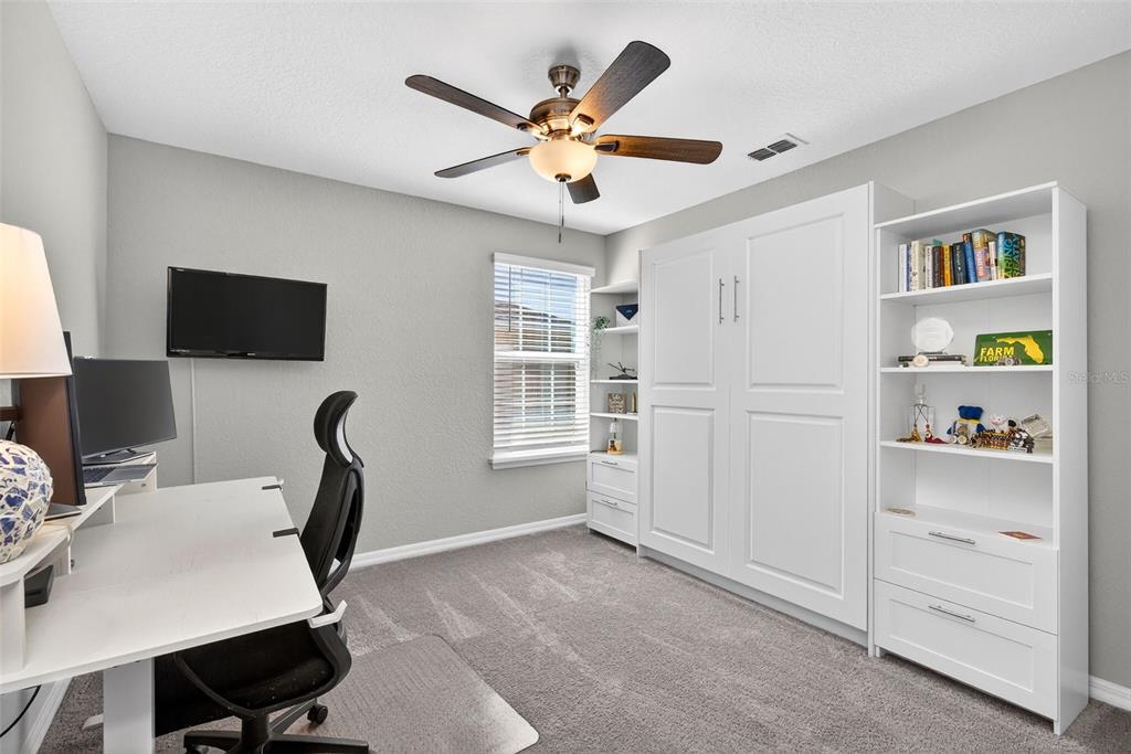 82 Berlin Avenue St. Cloud, FL 34771 - Photo 30 of 44 a work room with furniture and a window