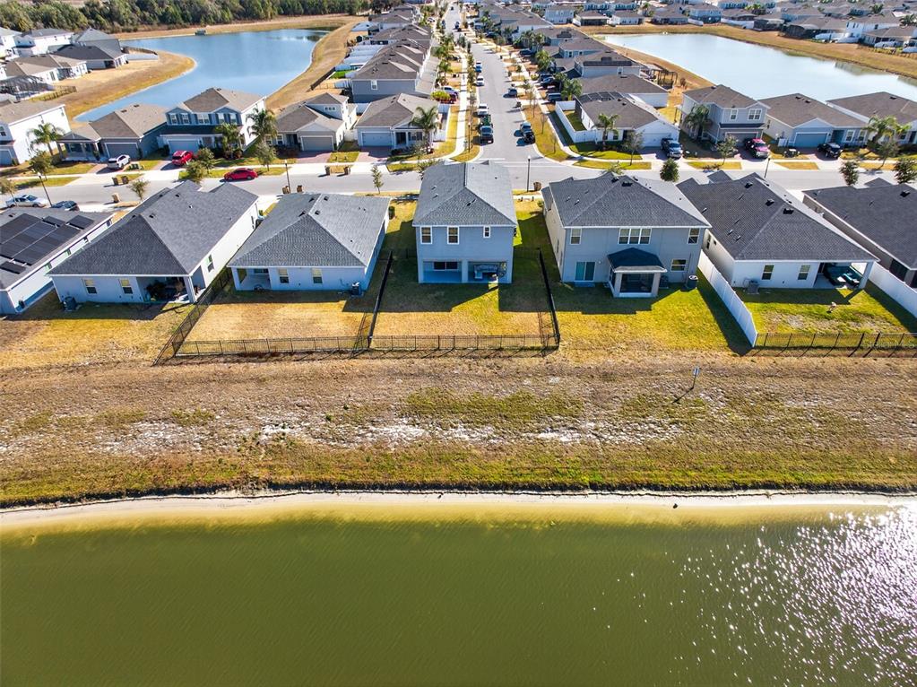 82 Berlin Avenue St. Cloud, FL 34771 - Photo 40 of 44 a view of multiple houses with a swimming pool