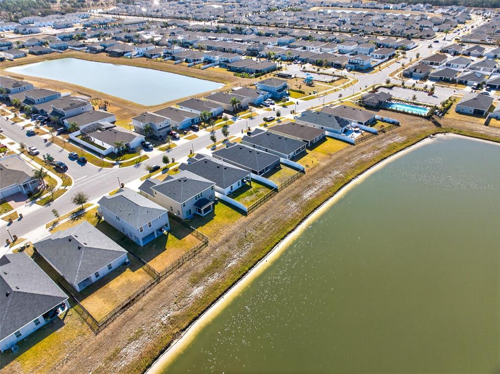 82 Berlin Avenue St. Cloud, FL 34771 - Photo 41 of 44 an aerial view of residential houses with outdoor space