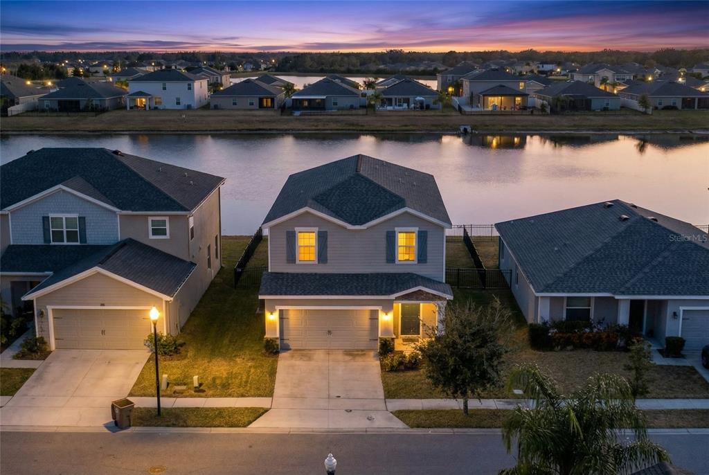 82 Berlin Avenue St. Cloud, FL 34771 - Photo 6 of 44 an aerial view of a house with a lake view
