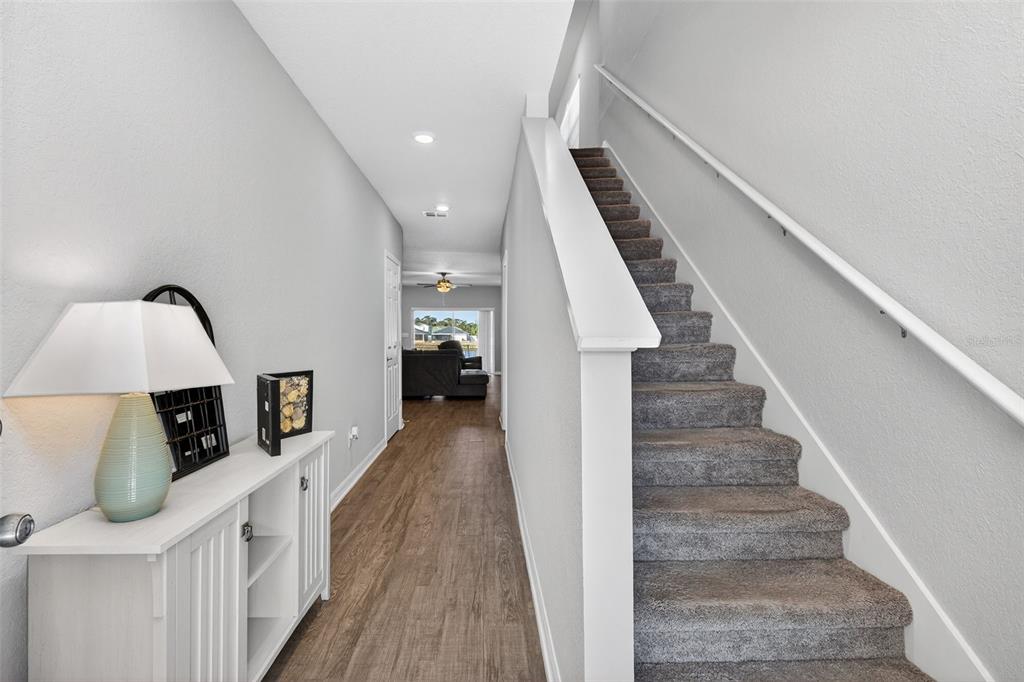 82 Berlin Avenue St. Cloud, FL 34771 - Photo 7 of 44 a view of entryway and hall with wooden floor